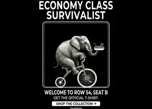 High-definition T-shirt design featuring a witty illustration of a large elephant balancing a meal tray while riding a tiny tricycle, with the text 'Economy Class Survivalist' in bold white letters on a black background.